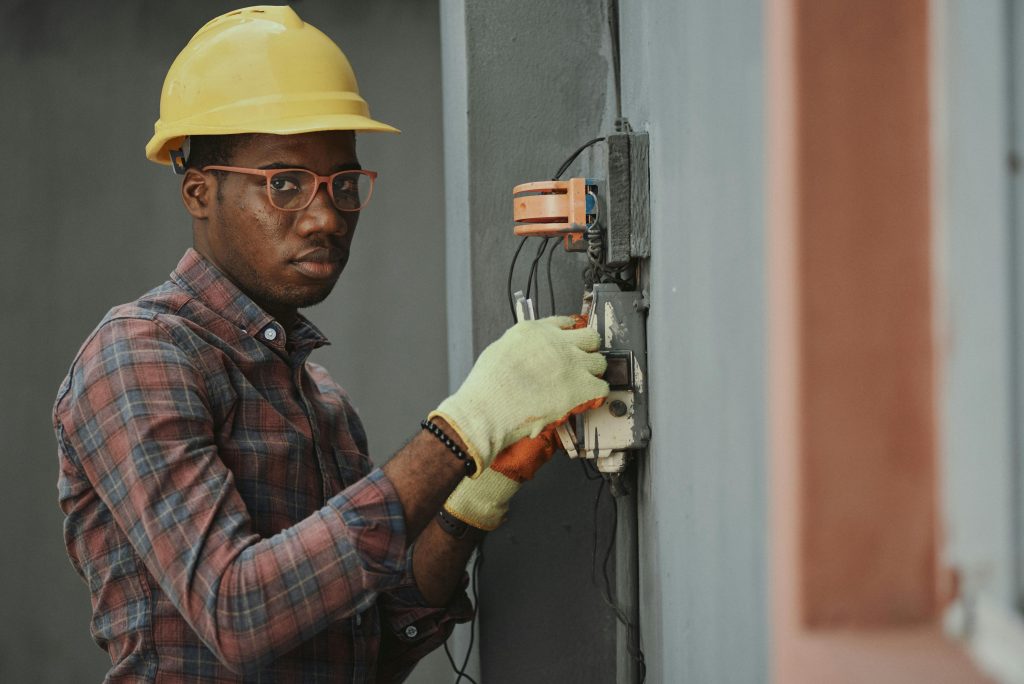 Electrician with a hard hat on the job